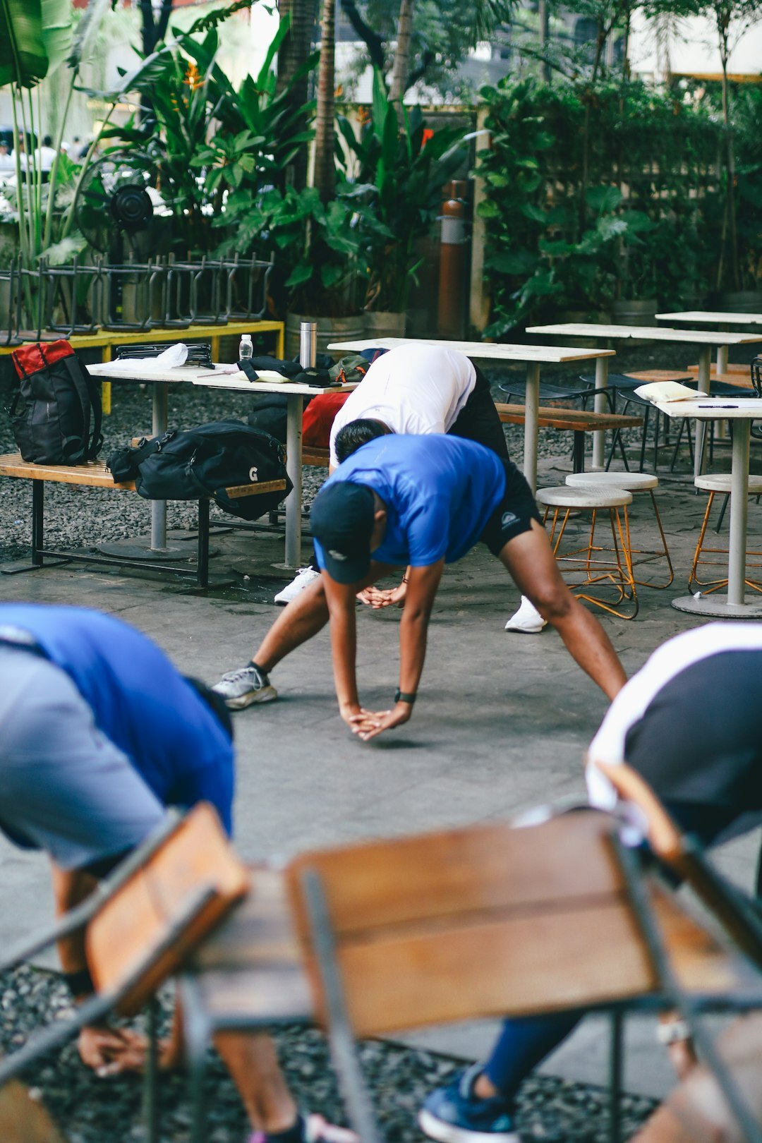 Seniors doing outdoor group stretching exercise