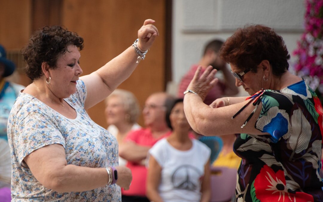 Senior couples dancing together in a community hall