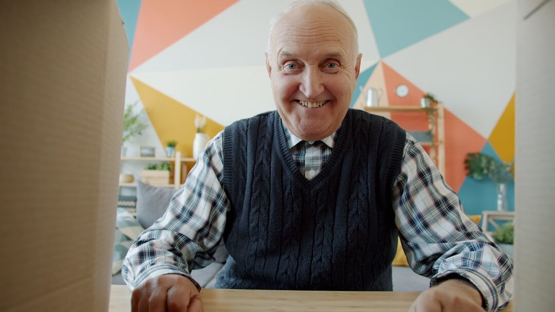 Portrait of a friendly senior man community coordinator