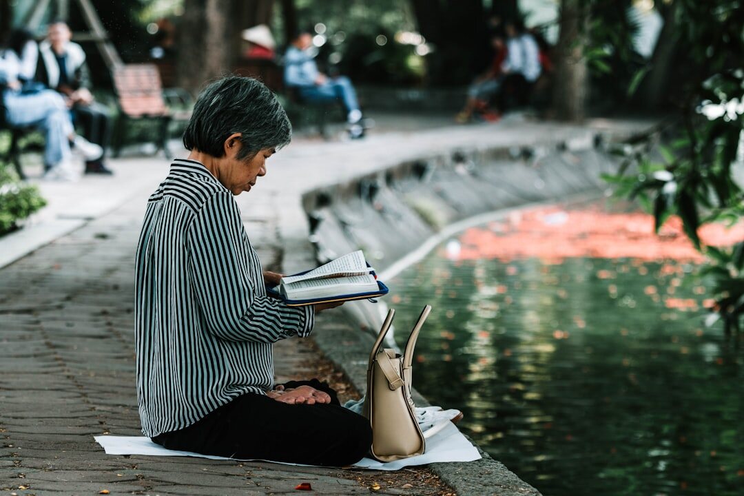 senior woman reading festival program