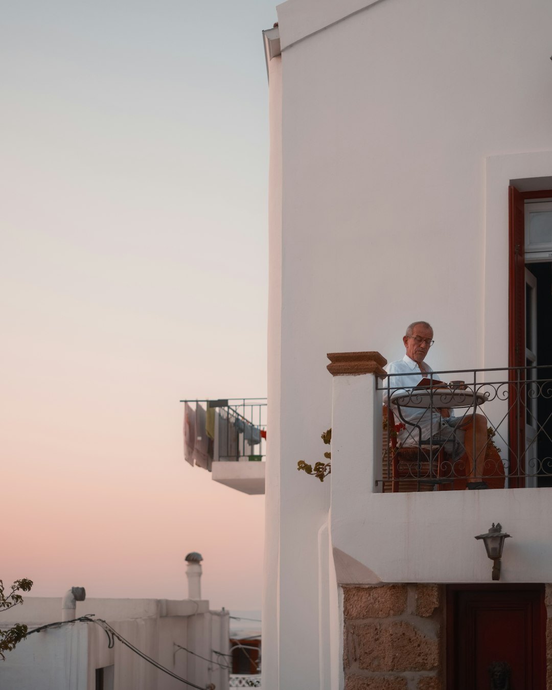 retired couple reading on balcony