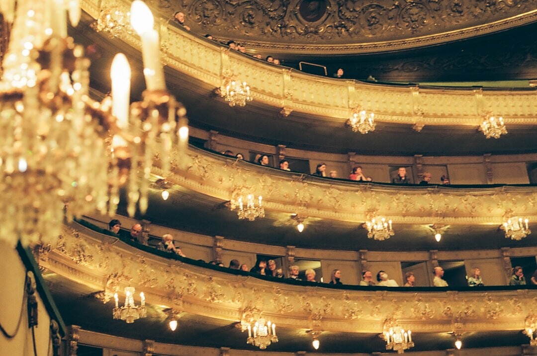 Seniors sitting together in a theatre audience